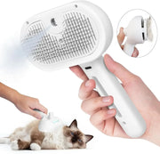 Self-Cleaning Pet Comb with mist spray used on a cat, showing hair removal and grooming function for dogs and cats. Ideal for detangling fur.